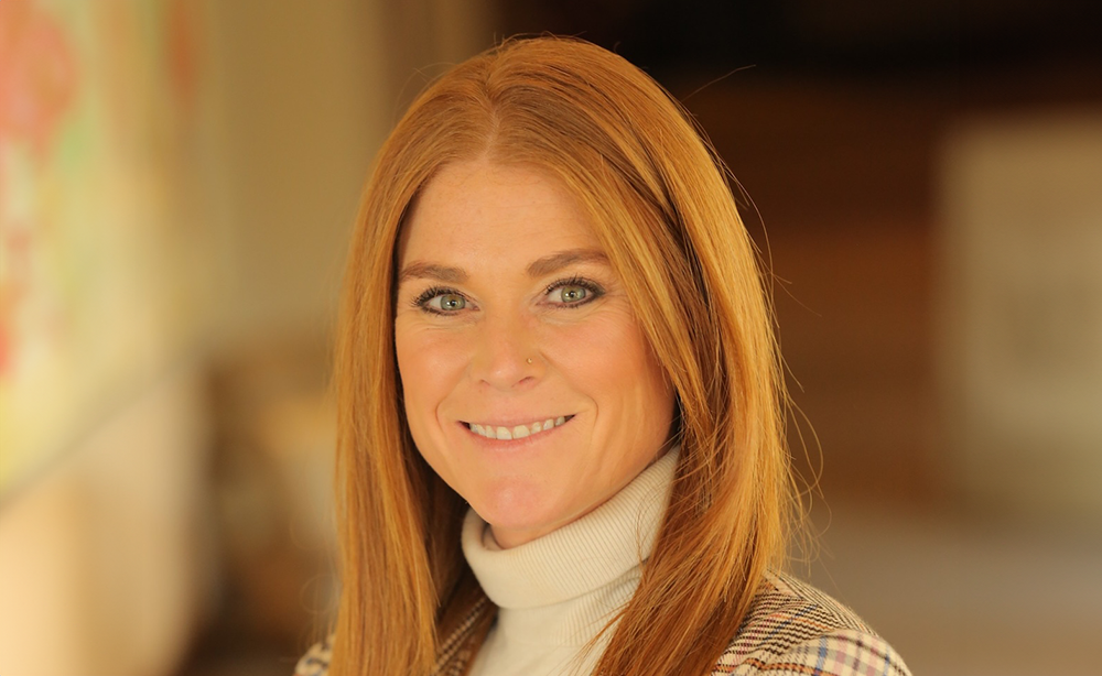 Headshot of Erin, Cal Poly Conferences staff member, with long red hair